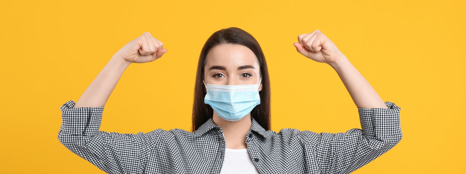 Woman wearing mask showing strength for natural immunity boost