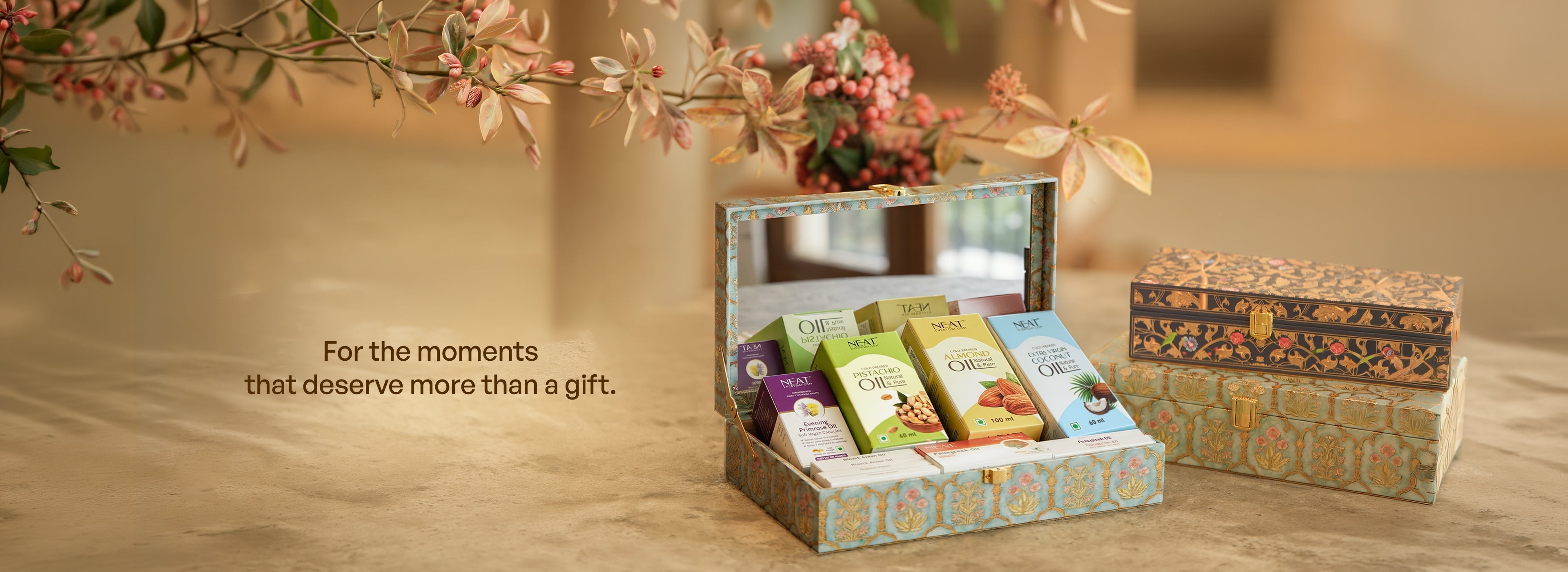 Stylish gifting boxes including grooming kits, candles, and self-care sets.
