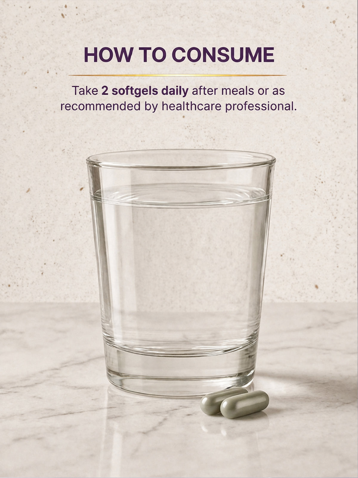 Glass of water with two softgels on a marble surface, with text on how to consume.