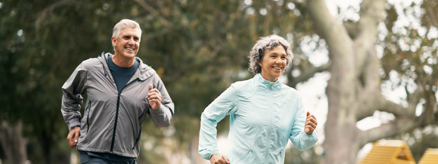Active seniors jogging outdoors, promoting plant-based Omega 3-6-9 benefits.