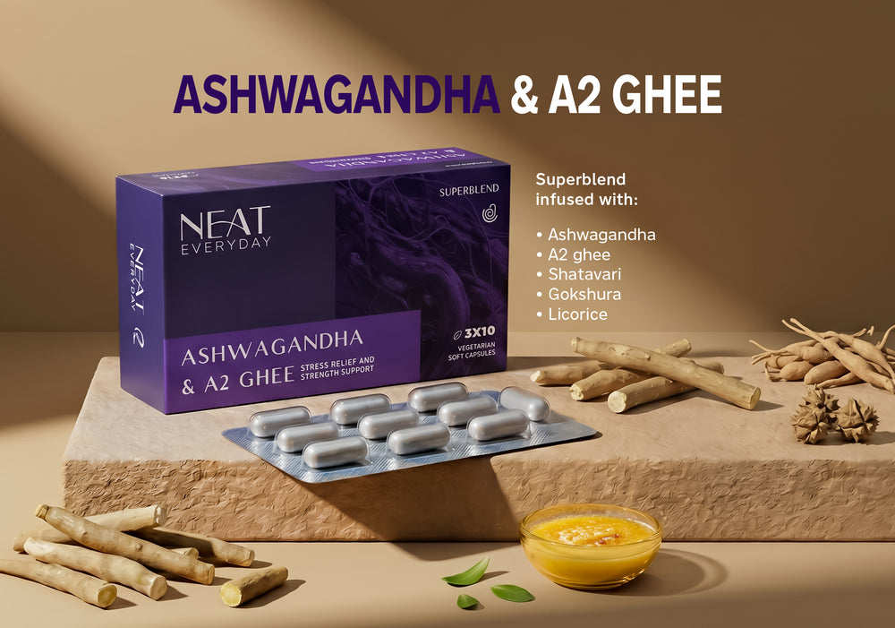 NEAT Everyday Ashwagandha & A2 Ghee supplement packaging with ingredients on a stone surface.