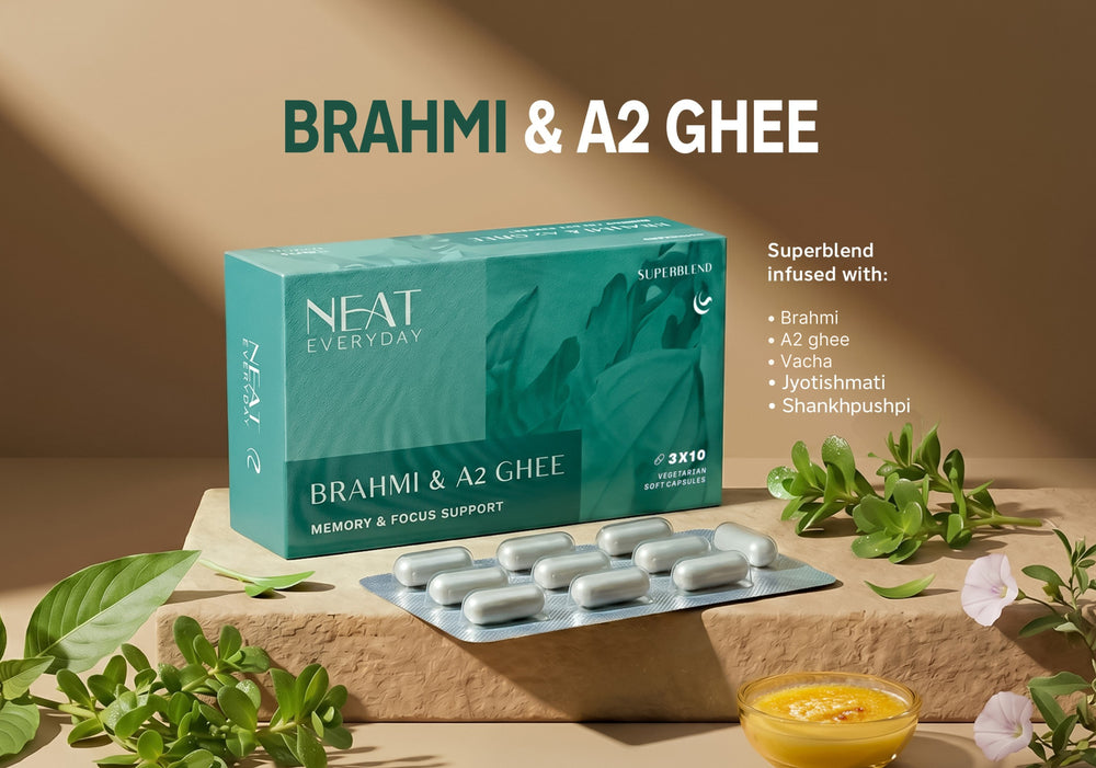NEAT Brahmi & A2 Ghee supplement packaging on a wooden surface with herbs and ghee.