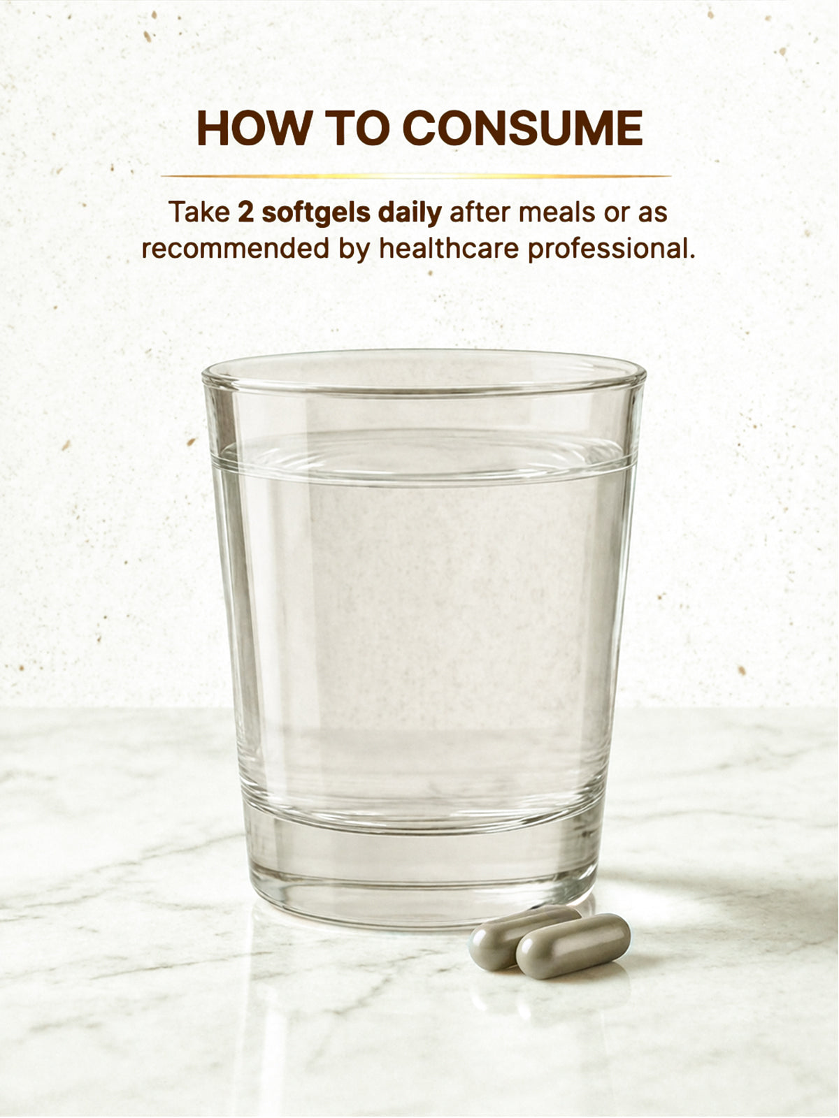 Glass of water with two softgels on a marble surface, with text on how to consume.