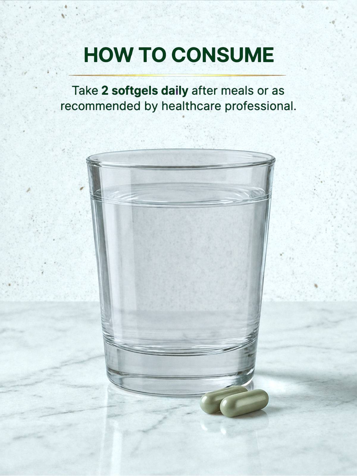Glass of water with two softgels on a marble surface, with text on how to consume.