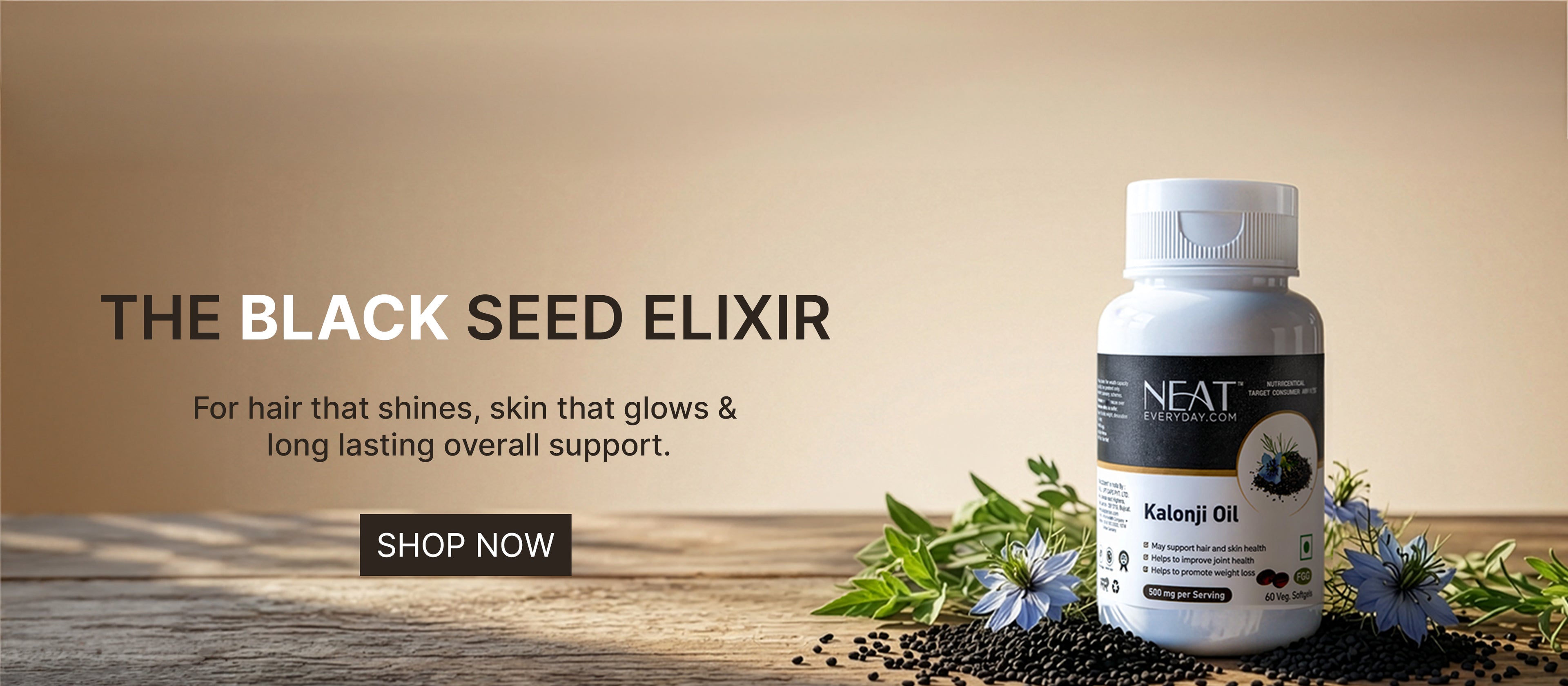 NEAT Black Seed Elixir bottle with black seeds and flowers on a wooden surface.