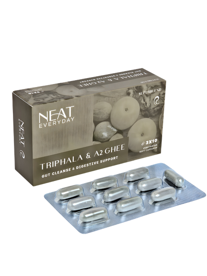 Packaging of NEAT Everyday Triphala &amp; A2 Ghee capsules on a white background