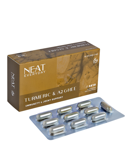 Neat Everyday Turmeric &amp; A2 Ghee supplement packaging with capsules on a white background