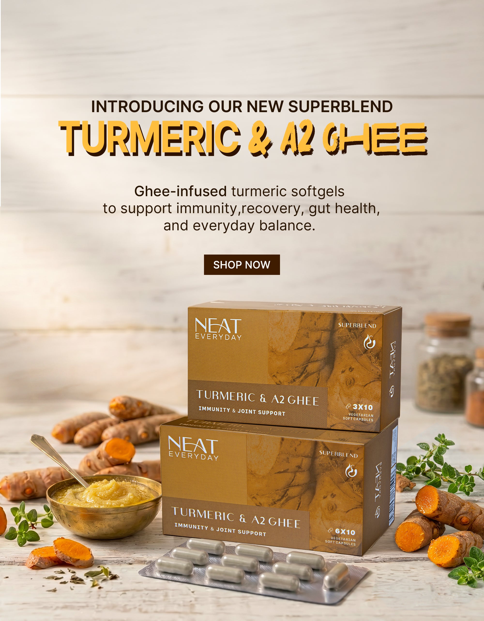 Turmeric and A2 Ghee supplement packaging with ingredients on a wooden surface